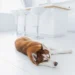 Golden Retriever with concerned owner checking fresh bright red stool on the floor, soft indoor lighting